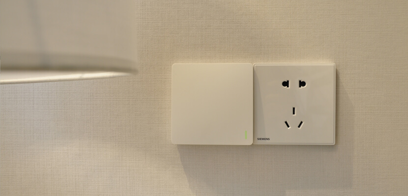 Wireless kinetic switch and traditional socket side by side